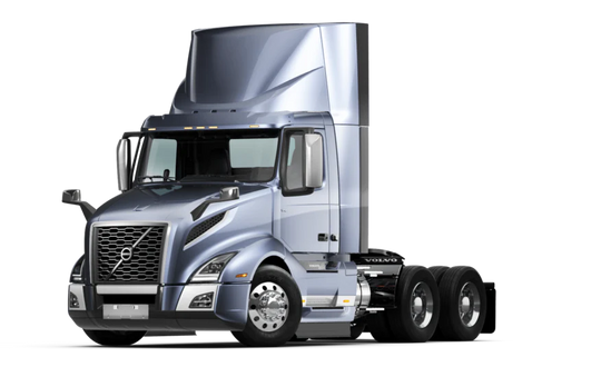 Silver semi-truck cab with aerodynamic design and large side mirrors isolated on a white background