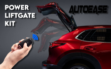 Autoease TL105G3 Power Liftgate Kit remote opening the rear liftgate of a red SUV with professional installation.