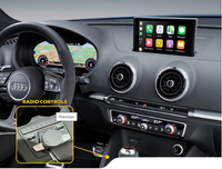 Audi car interior showing digital instrument cluster, multimedia touchscreen, and radio control dial on center console