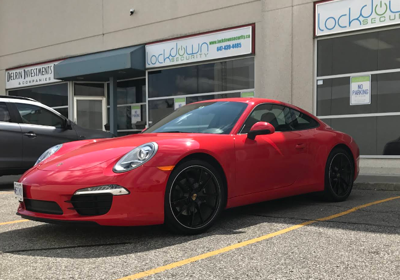 Red Porsche 911 parked outside Lockdown Security's shop in Markham