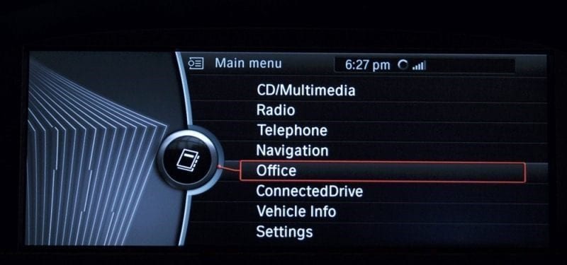 Car infotainment main menu screen displaying options including CD/Multimedia, Radio, Navigation, and Settings at 6:27 pm.