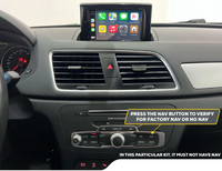 Car dashboard with center multimedia screen showing Apple CarPlay and control panel with navigation button indicator.